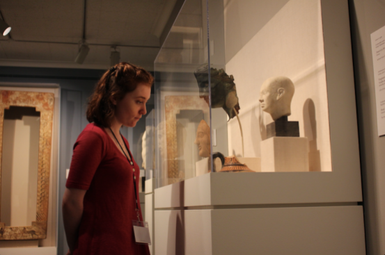 A girl stares at roman artifacts