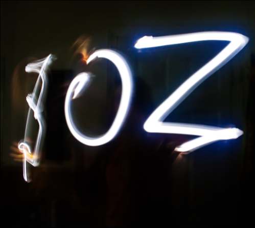 My sister, Zoe, spells out her name in the dark.